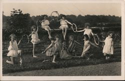 Group of young girls in short dresses and flower rings May Day Children Postcard Postcard Postcard