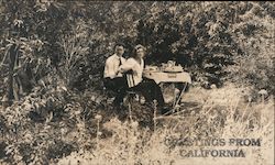 Couple eating a meal at table in Golden Gate Park. Greetings from California San Francisco, CA Postcard Postcard Postcard