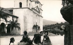 Mission with people in fancy dress in courtyard Postcard