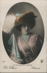 Colorized photo of woman in feathered hat. La Toilette au Theatre. De Villars Athinie Postcard