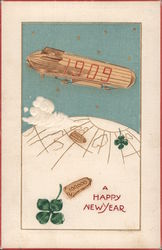 A happy New Year - 1909 blimp over the earth. Year Dates Postcard Postcard Postcard