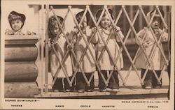 Dionne quintuplets standing at gate. Yvonne, Marie, Cecil, Annette, Emelie Babies Postcard Postcard Postcard