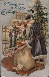 Wishing you a happy Christmas. Children in bed as Santa stuffs stockings. Santa Claus Postcard Postcard Postcard