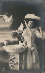 Woman with doves and bird bath Birds Postcard Postcard Postcard