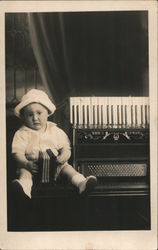 Little boy with toy accordion next to real accordion Music Postcard Postcard Postcard