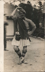 Man in highland pose with kilt and costume Postcard