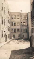 Girl in an empty back yard Postcard