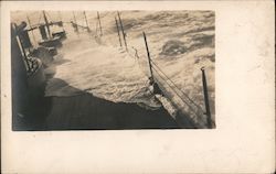 1910 Storm waves breaking over ship bow Postcard