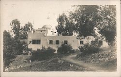 Adobe Building with a dome in a wooded area Postcard