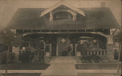 Bungalow, Woman rocking on her porch, street view California Buildings Postcard Postcard Postcard