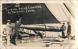 Torpedo being lowered to torpedo room on ship Ships Postcard Postcard Postcard