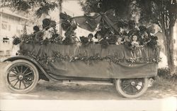 Parade car covered in roses, children riding Cars Postcard Postcard Postcard