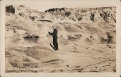 Odd rock formation, Wigdan Sea, La Jolla. Man touching it Postcard