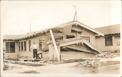 "How in Thunder Did I Get Out?" man outside a wrecked house Long Beach, CA Postcard Postcard Postcard