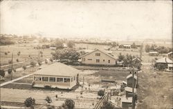 houses and farm fields in an unidentified town Postcard