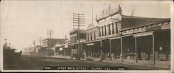 Main Street, Gilroy, California - vintage photo with horse-drawn traffic Postcard