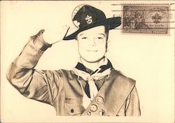 Boy Scout saluting in uniform. Postcard