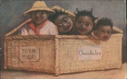 Box of Chocolates. Four little black kids in wicker box. Postcard