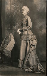 Woman in a formal gown. Message written by the woman in the photo. Postcard