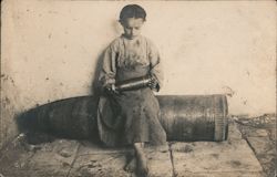 Barefoot girl with large artillery shell World War I Postcard Postcard Postcard