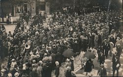 Soldiers parade through town Postcard