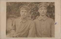 A portrait of two male soldiers looking at camera Postcard