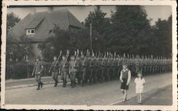 Soldiers Marching Down Street Postcard