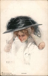 Danger - A woman with a large hat and a hatpin between her teeth Postcard