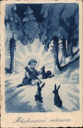 Blessed Christmas - a cherub sits in the snow under the trees with rabbits and a squirrel. Angels Postcard Postcard Postcard