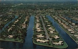 Aerial view of many new homes and surrounding waterways in the "Venice of America" Postcard