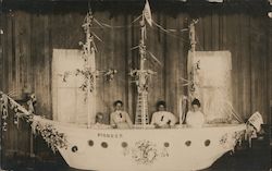 "Pioneer", women in flower-decked model boat Postcard