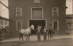 Two men holding horses in front of a barn Postcard Postcard Postcard