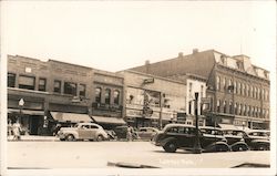 Storefronts from 40s, vintage cars parked on street Lapeer, MI Postcard Postcard Postcard