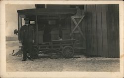 Conductor poses with small rail vehicle Postcard