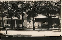 Two-Story Houses on a Street Lined with Large Trees Buildings Postcard Postcard Postcard