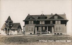 Catholic School building, Winnebago, students seated on porch Postcard