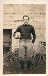 Football Player Standing in Front of Bicycle Postcard