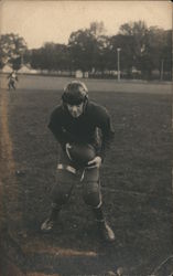 Football Player Crouching with Ball Postcard