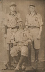 Three Baseball Players Pictured with Uniforms Displaying "LD" Postcard Postcard Postcard