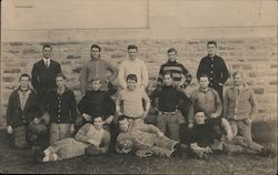 NLHS 1911 Football Team Posing in Front of Brick Wall Postcard