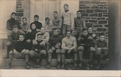 1906 Football Team Seated in Front of Building Postcard