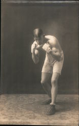 Single Male Boxer without Shirt in Defensive Position with Wrapped Fists Up Postcard