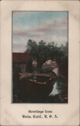 Greetings from Biola - Boat, Trees, Log Shack Postcard