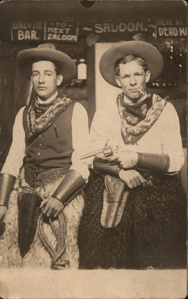 Two Men dressed as Cowboys in a Bar, Wooly Chaps Studio Photos Postcard