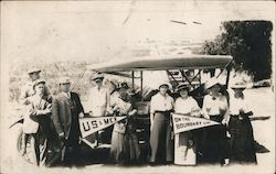 People posing holding flags: US & Mex, On the Boundary Line Postcard