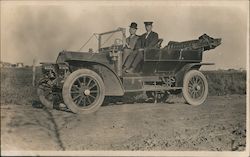 Two men in hats in old Touring Car Postcard