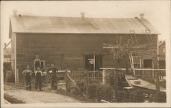 Four Men Outside A Barn w/Tractor Postcard