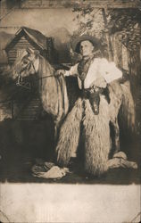 Cowboy Wearing Wooly Chaps and Holding a Pistol with a Horse Postcard