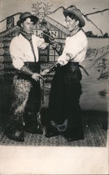 Two Men Dressed as Cowboys - One Pointing Pistol at the Other Postcard