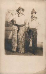 Two Young Men Dressed as Cowboys, Wooly Chaps, Pistol and Lasso Postcard